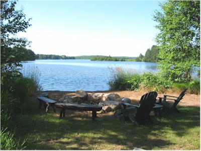 Lake and fire pit picture at Ruffed Grouse Lodge in Phillips Wisconsin